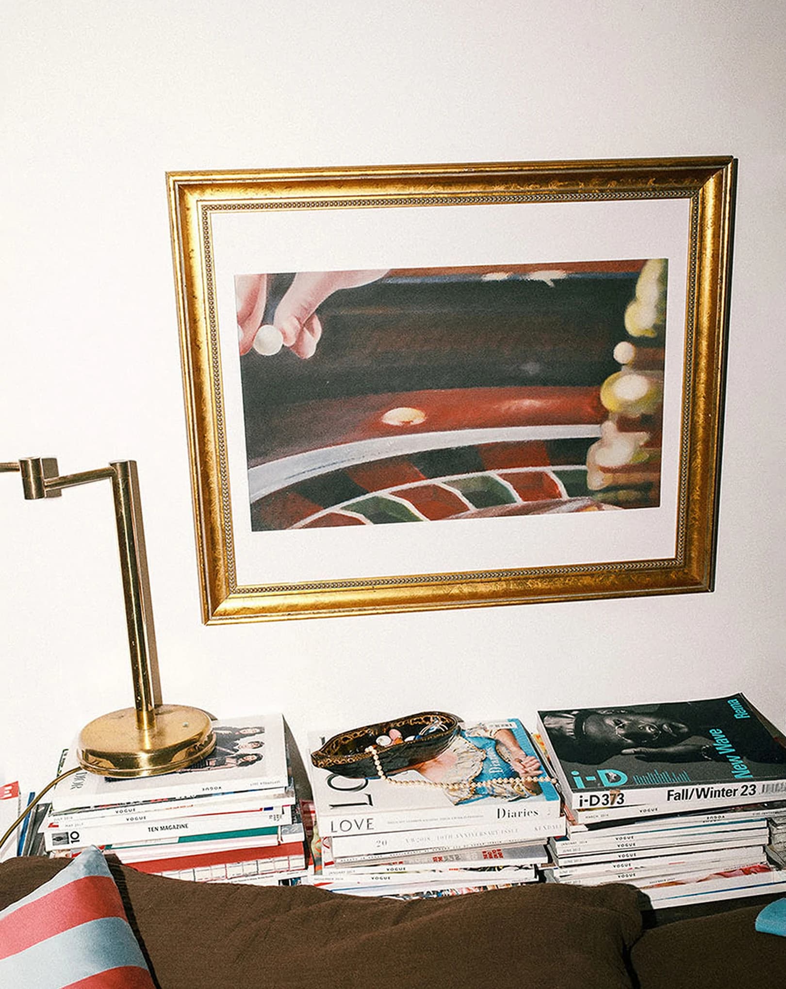 Large wall art print displayed above sofa in modern living room